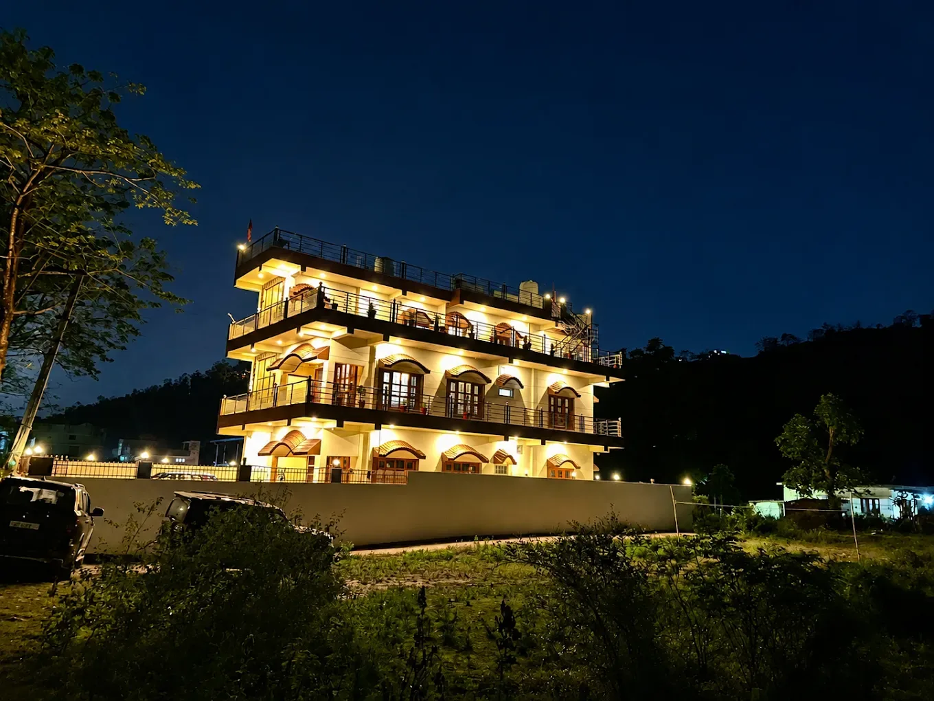 Beautiful night glow at White Wood Home Stay, offering a peaceful retreat under the evening sky.