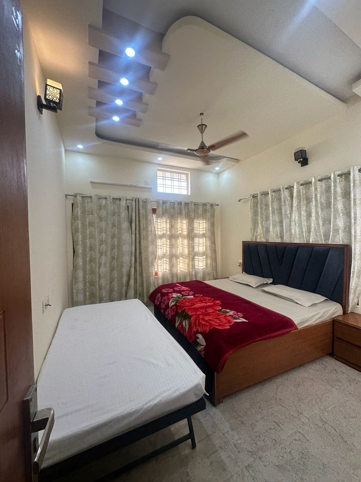 Comfortable bedroom setup with flexible bedding for family and friends.